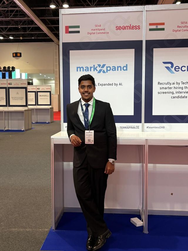 Usman leaning on the counter of the markXpand stand