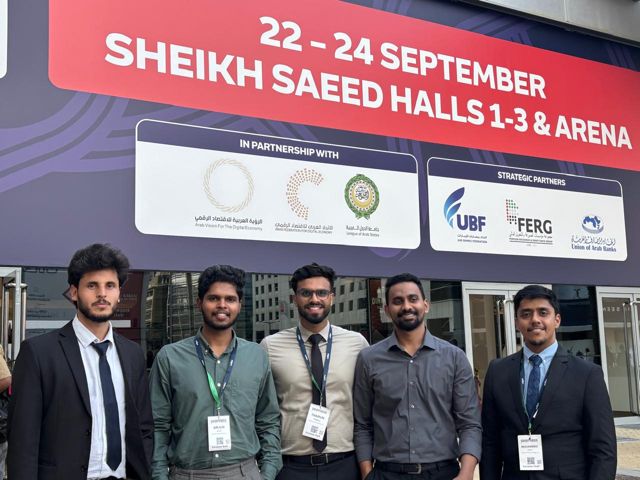 Five colleagues in formal wear outside the Seamless Middle East venue